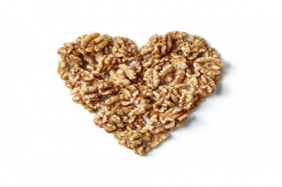 Study links eating just half a serving a day of nuts, such as walnuts, to a decreased risk of cardiovascular disease (CVD)